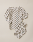 Floral patterned pajama set on a beige background