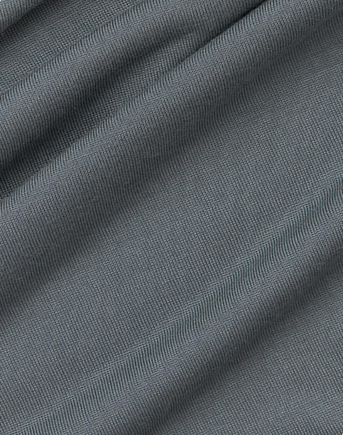 Gray ribbed knit fabric with a subtle stretch texture shown in close-up view.