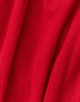 Close-up of red fabric with visible pointelle texture