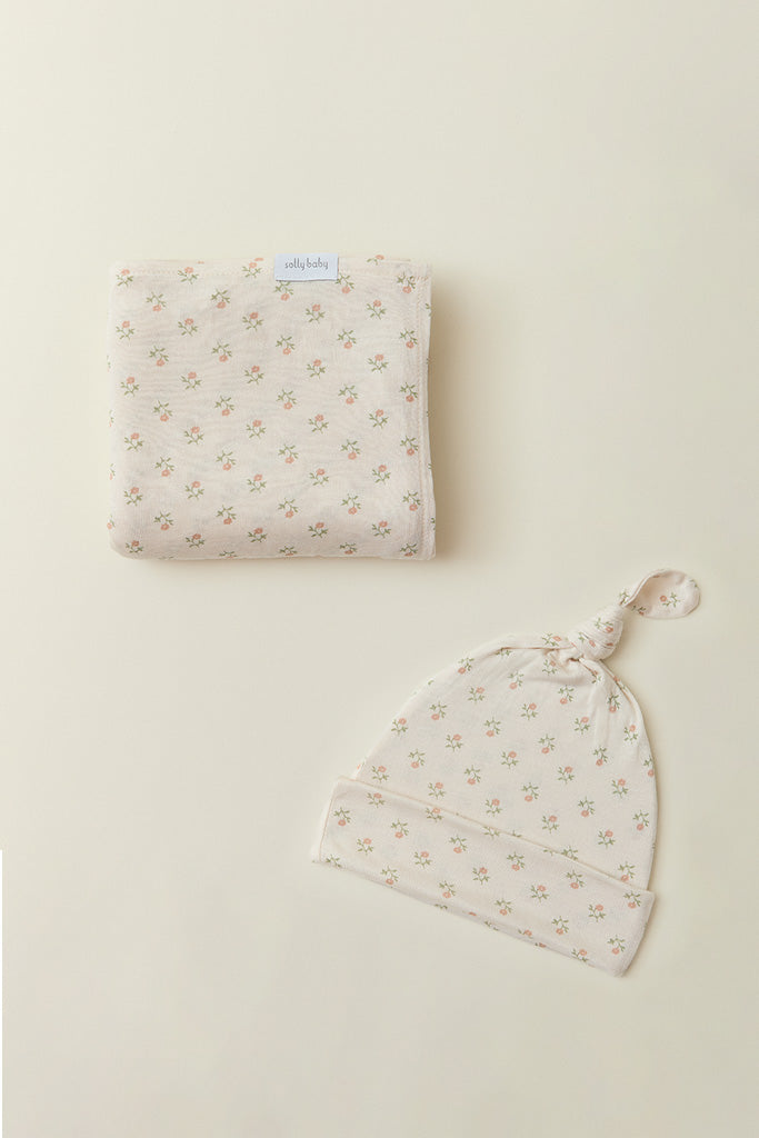 Image of Solly Baby's Blush Floret hat and swaddle set.