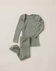 Set of mist pointelle ribbed pajamas on a beige background