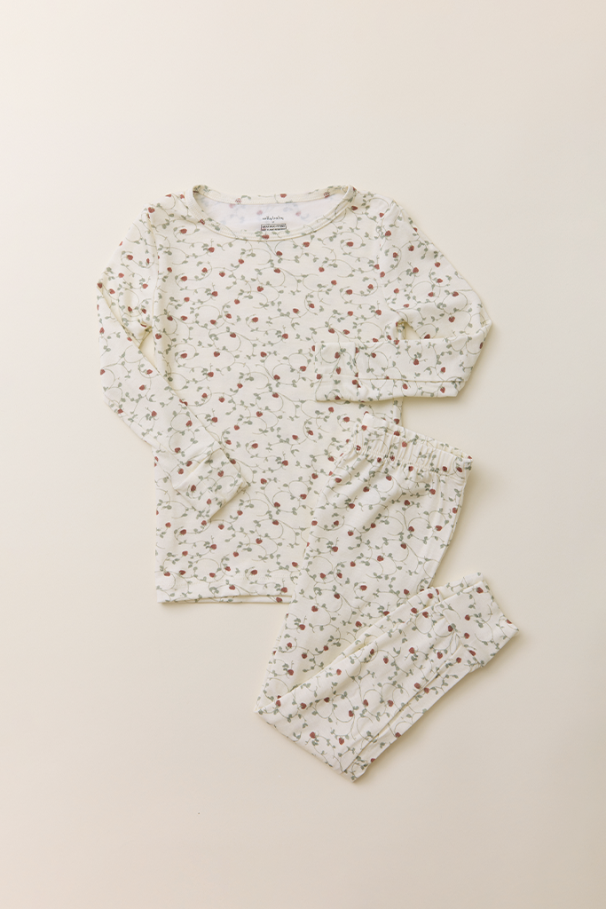 The Toddler Sleep Set in a dainty, strawberry vine print, featuring a long-sleeve top and matching leggings laid flat on a neutral background.