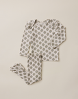 Floral patterned baby outfit on a beige background