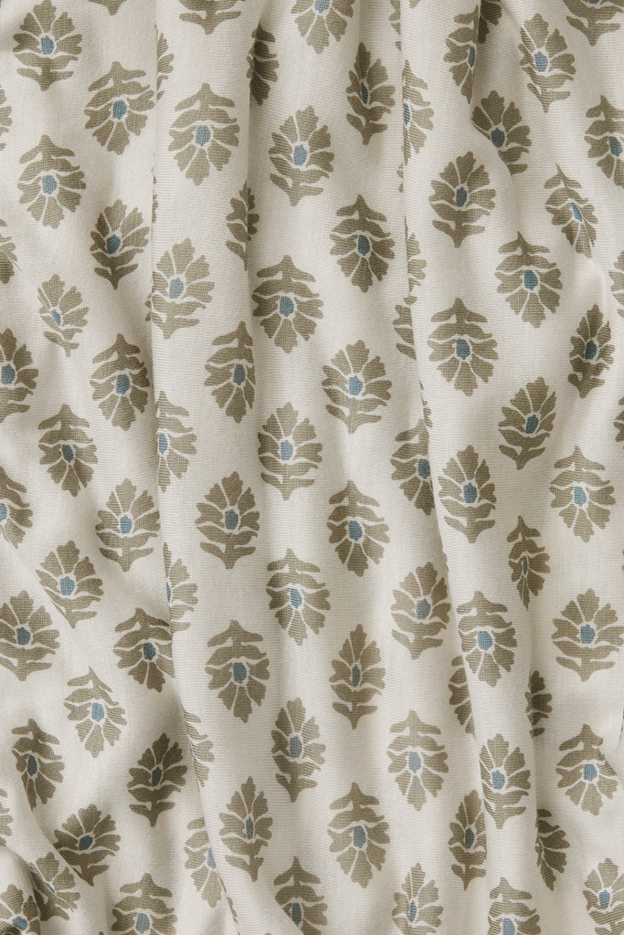Fabric with a leaf pattern on a beige background